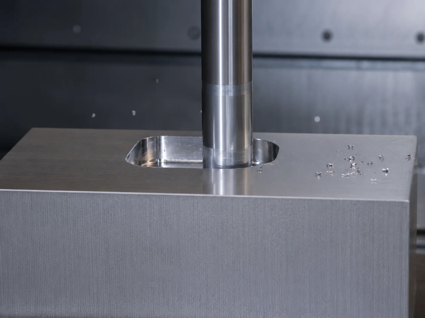 End mill sinking a cavity pocket into a solid steel mold block