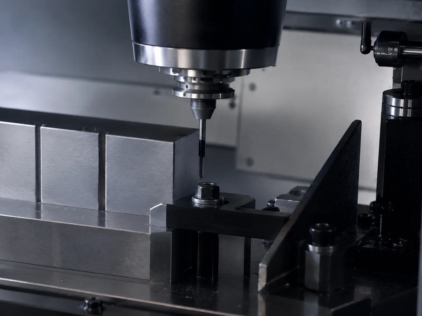 Slender end mill machining a clamped fixture component on a CNC machine
